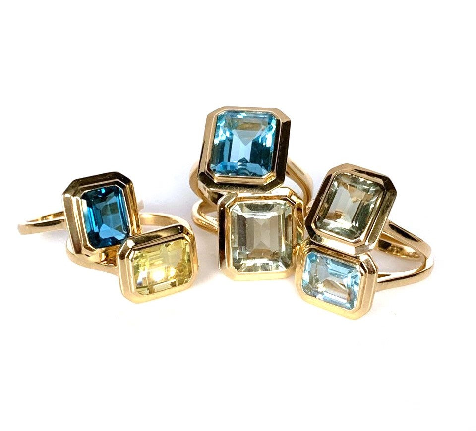 14k gold emerald cut blue topaz earrings ME2496BT